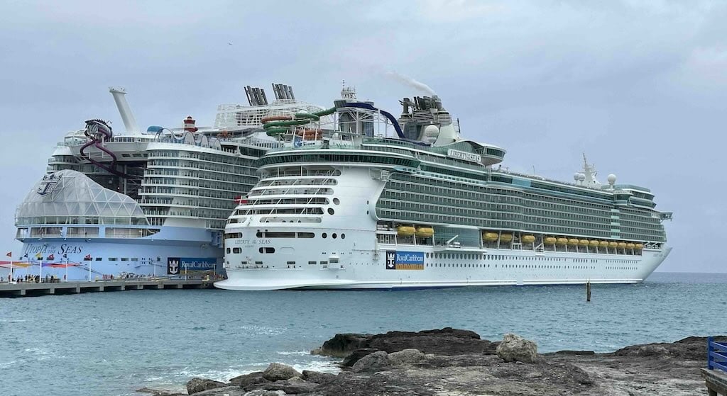Liberty of the Seas next to Utopia