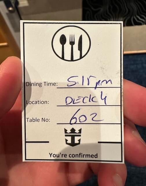 Royal Caribbean main dining room experience confirmation showing dining time, location, and table number