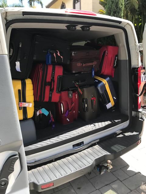 Luggage for family going on Royal Caribbean packed in the back of a van