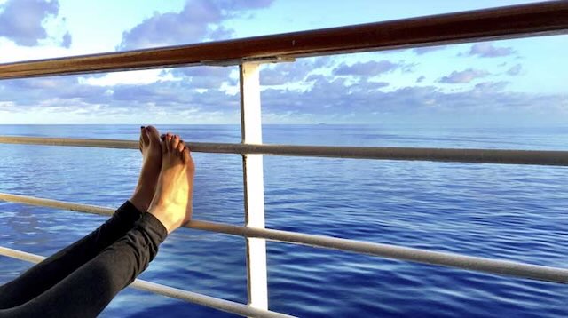 Relax feet kicked up on your cruise ship not having to worry about missing your ship