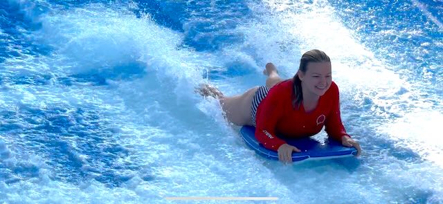 Woman on the FlowRider on Royal Caribbean Cruise Line
