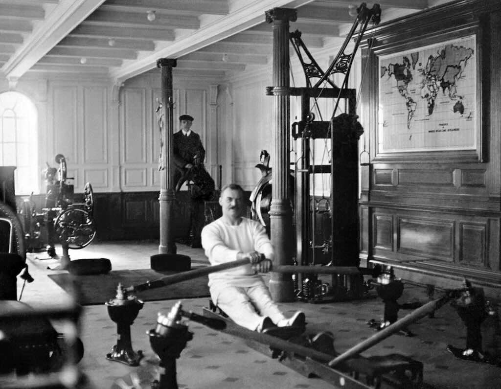 Titanic Gym man rowing and one in the back