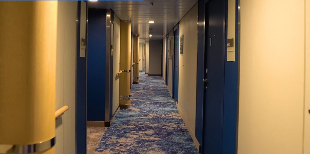 wonders of the sea cabins to avoid -Connecting cabin door inside a wonder of the Seas stateroom showing adjoining cruise cabins