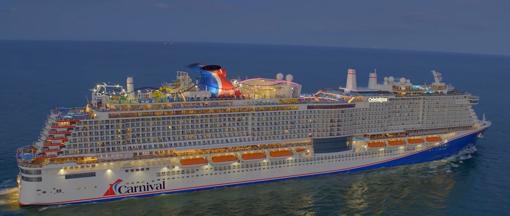 Aerial drone view of a colorful carnival celebration taking place on the open sea