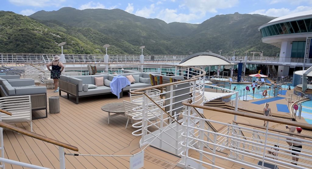 Cabins to avoid on Voyager of the seas with mountains in the background docked