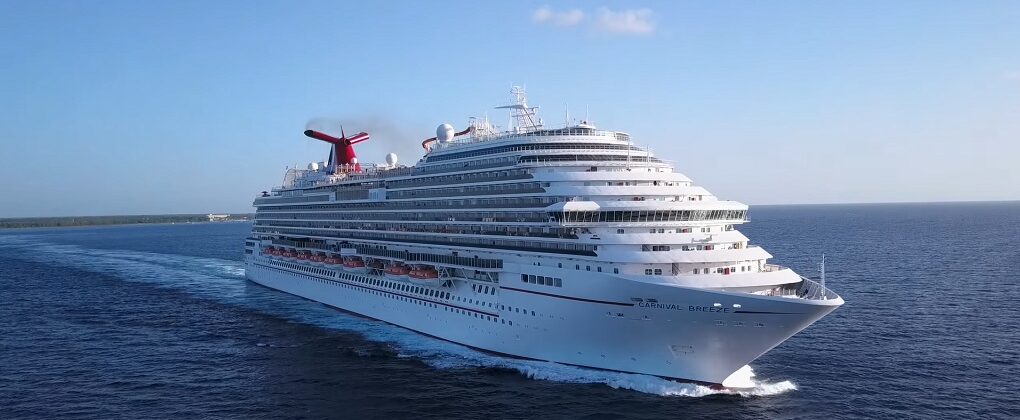 Aerial drone view of Carnival Breeze cruising at sea