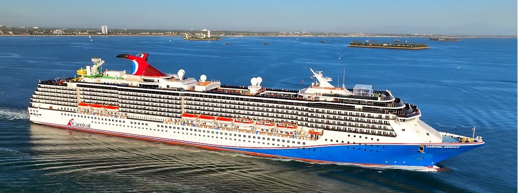 Aerial drone view of Carnival Miracle cruising at sea