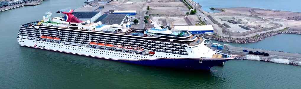 Aerial drone view of Carnival Pride cruising at sea
