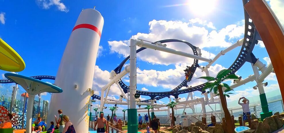 Mardi Gras BOLT Roller Coaster - Man riding BOLT roller coaster at day time 